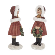 Piros színű karácsonyi kislány figura.