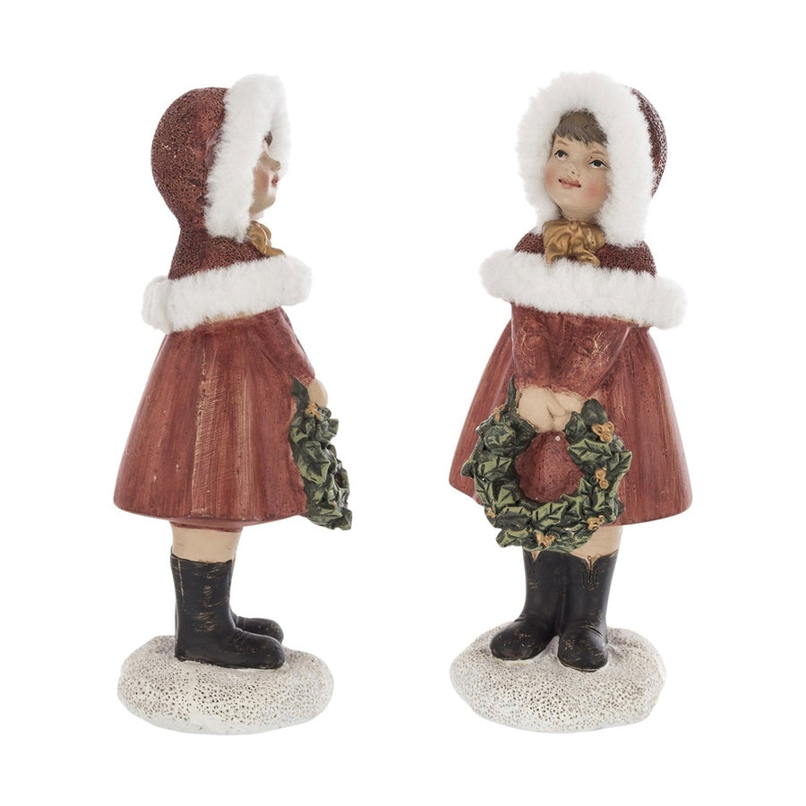 Piros színű karácsonyi kislány figura.