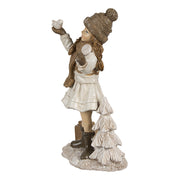 Tradicionális megjelenésű, madárkát tartó, bézs színű karácsonyi kislány.