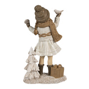 Tradicionális megjelenésű, madárkát tartó, bézs színű karácsonyi kislány.