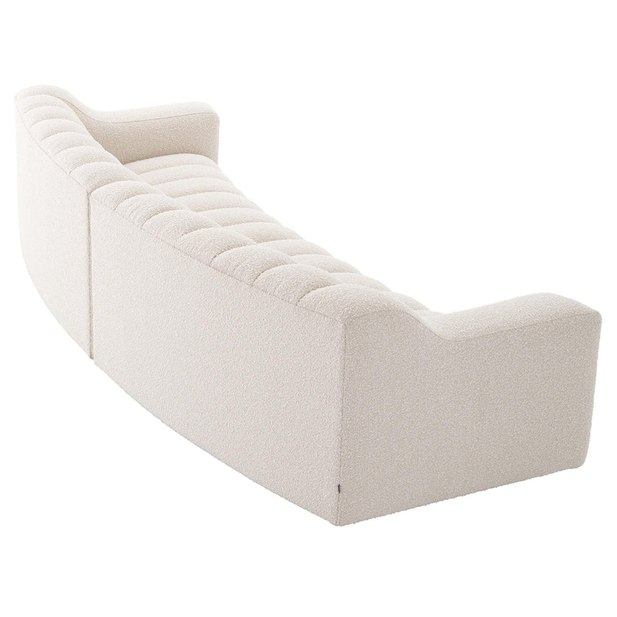 Krémszínű buklé szövettel kárpitozott óriás dizájn kanapé.