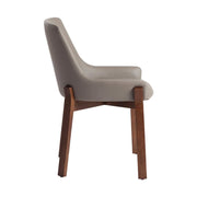 Bézs színű műbőrrel kárpitozott, kőrisfából készült, formatervezett dizájn étkezőszék.