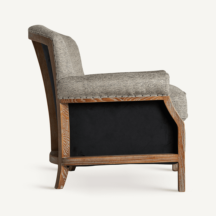 Oldalnézet: Laronxe fotel szürke szövettel, fa vázzal és kényelmes ülőfelülettel.