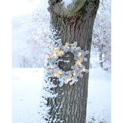 Melegfehér fényű LED-el felszerelt, mű cédrus fenyő koszorú.