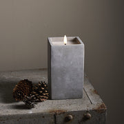 Szürke cement tégelyben kialakított LED gyertya.
