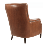 A fotel hátulnézeti képe, antikolt dohánybarna bőrrel és finoman pácolt, enyhén ívelt háttámlával