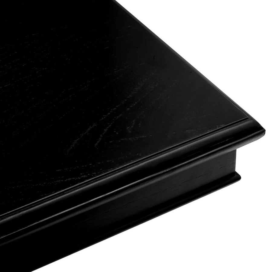 Fekete színű mindifa furnérból készült, formatervezett központi könyvtár asztal.