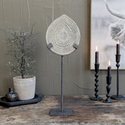 Fém talapzaton álló, antik szürkésbarna színű, kézműves mangófa dísz.