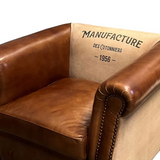 MANUFACTURE bőrfotel háttámla vintage felirattal, közelről