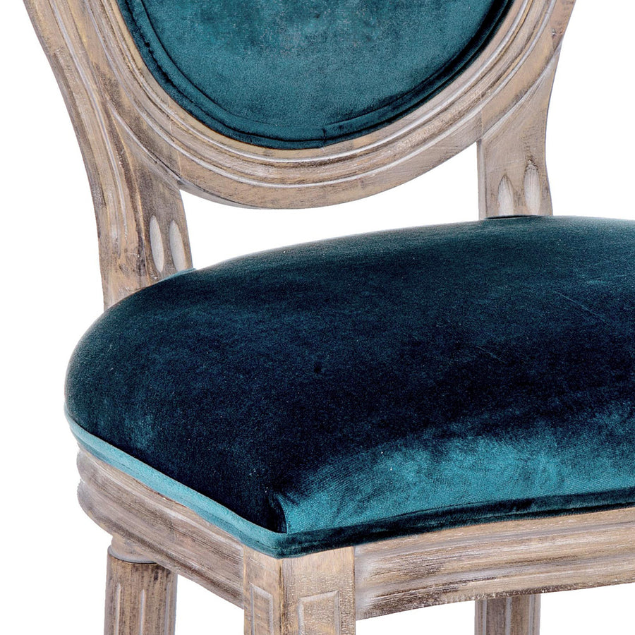 Párizsi kék színű, bársony hatású szövettel kárpitozott étkezőszék.