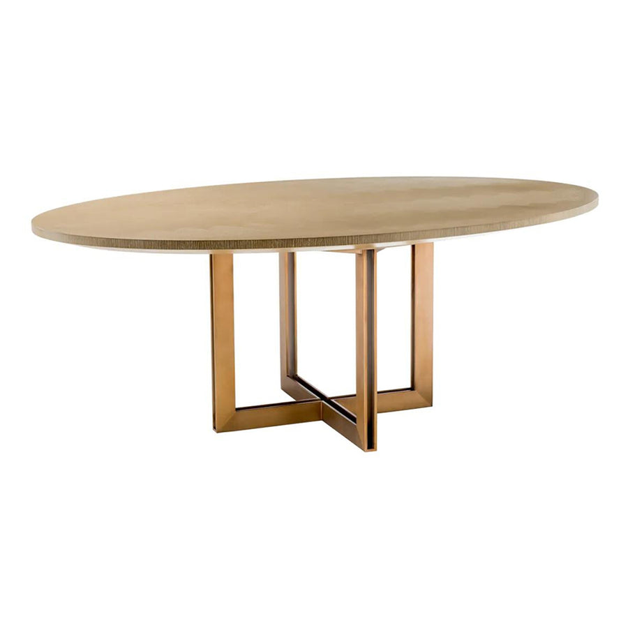 Natúrszínű tölgyfurnérból és sárgaréz felületű rozsdamentes acélból készült, ovális formájú design étkezőasztal.