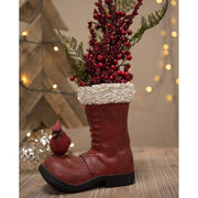 Kardinálispinttyel díszített, bordó színű mikulás csizma.