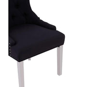 Ezüstszínű, rozsdamentes acéllábbakon álló, fekete színű poliészter vászonnal kárpitozott dizájn étkezőszék.