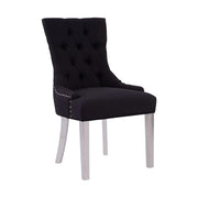 Ezüstszínű, rozsdamentes acéllábbakon álló, fekete színű poliészter vászonnal kárpitozott dizájn étkezőszék.