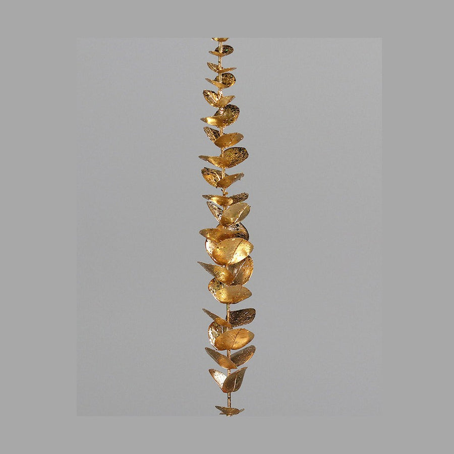 Fényes, aranyszínű levelekkel rendelkező, dekor eukaliptusz ág műnövény.