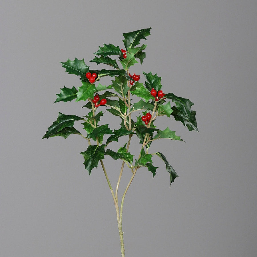 Piros bogyós karácsonyi mű magyal ág.