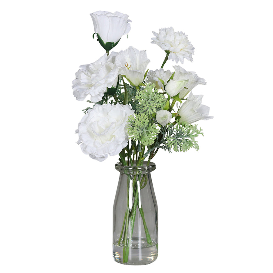 Krémszínű, vegyes művirágokból készült kompozíció, áttetsző üvegvázában..