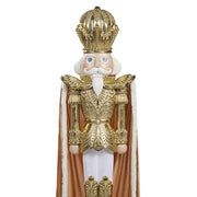 Óriás arany diótörő figura díszes koronával és ornamentált arany öltözékkel