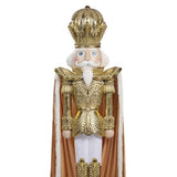 Óriás arany diótörő figura díszes koronával és ornamentált arany öltözékkel