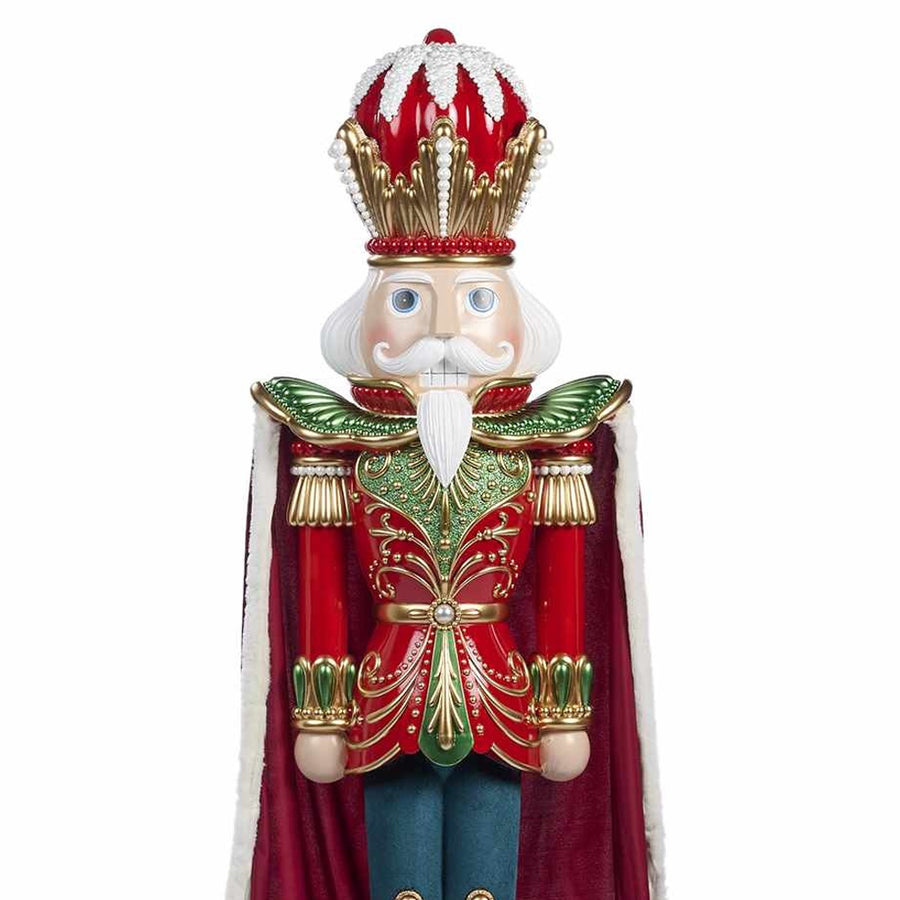 Óriás diótörő figura piros arany koronával és zöld arany díszítésű öltözékkel