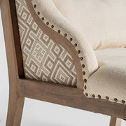 Bézs fotel oldalsó mintás szövetbetéttel