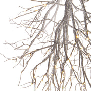 Fényforrással kialakított, havas felületű, karácsonyi dekorációs faág..