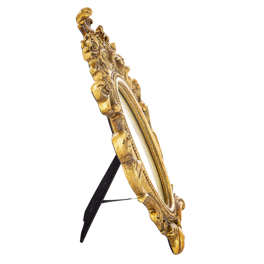 Barokkos levéldíszekkel díszített, antikot felületű, aranyszínű asztali fényképtartó képkeret.