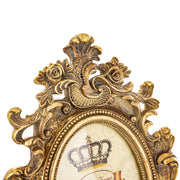 Barokkos levéldíszekkel díszített, antikot felületű, aranyszínű asztali fényképtartó képkeret.