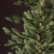 Jutazsák talapzattal kialakított dekorációs műfenyő.