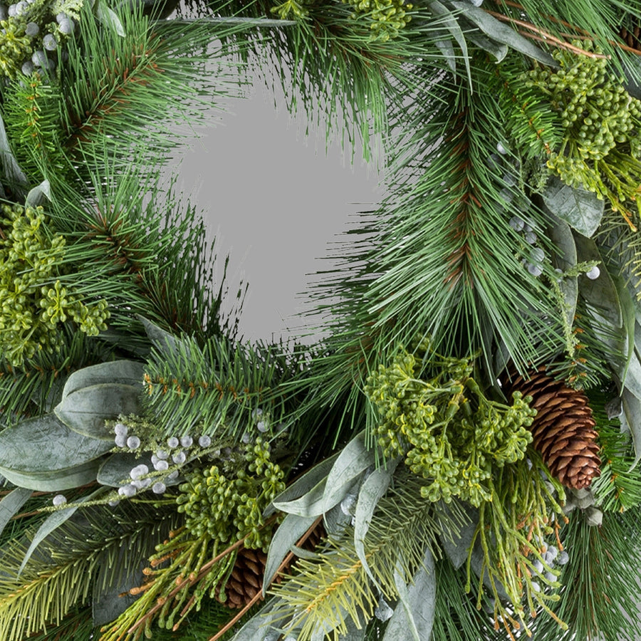 Zöld színű, mű fenyő mix koszorú.