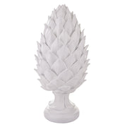 Fehér színű, dekoratív toboz dísz.