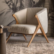 Prati buklé fotel nappali környezetben, modern enteriőrben elhelyezve.