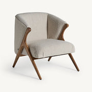 Prati buklé fotel oldalnézetben, fa vázzal és puha kárpitozással.