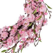 Rózsaszín, cseresznyevirág koszorú.