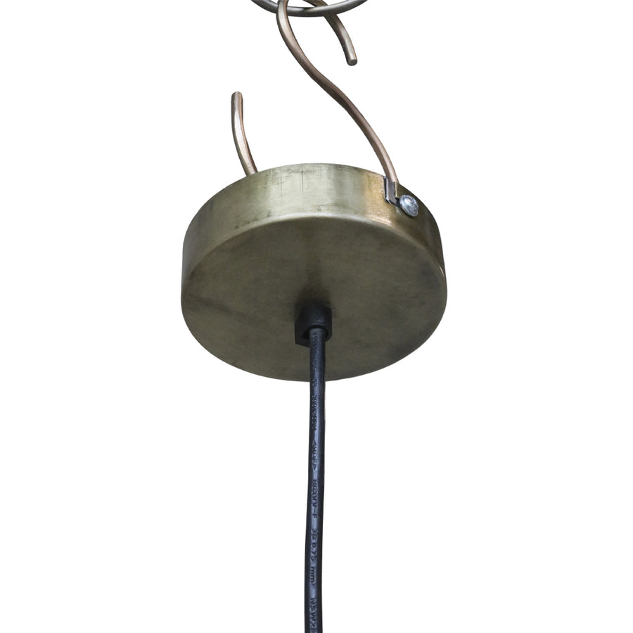Close up of the ceiling mount for the Old French rattan pendant lamp showing a round brass canopy and attached cord.
