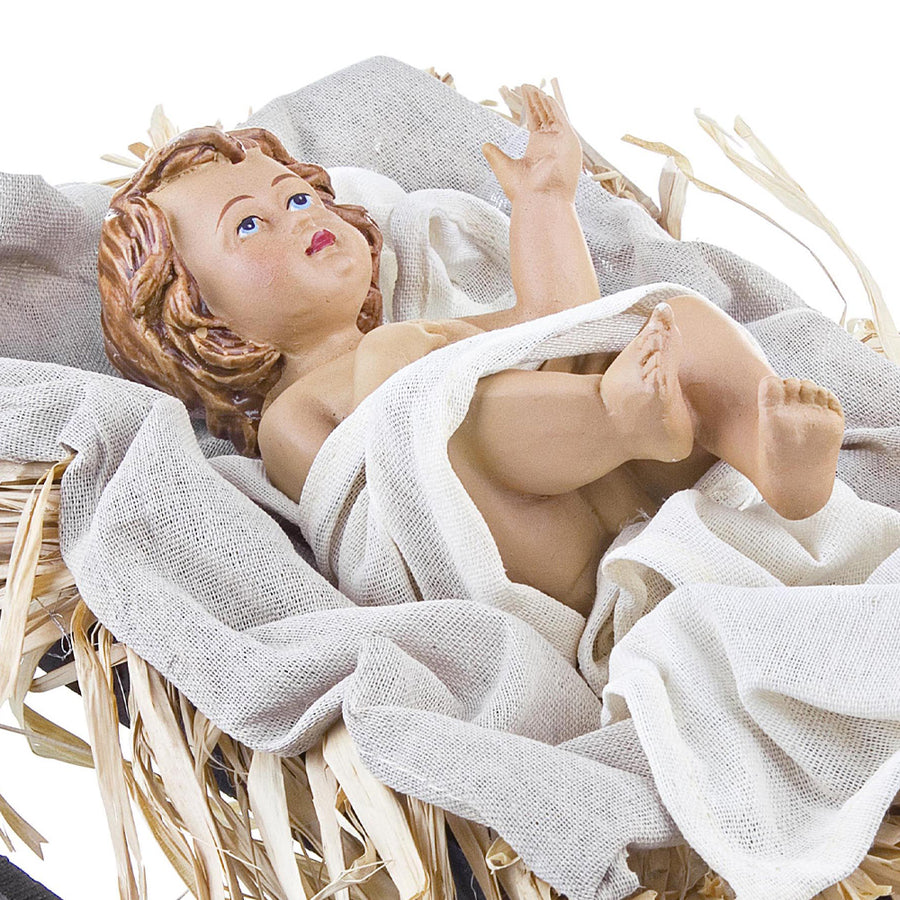 Sacred kis Jézus figura jászolban fehér textíliák és szalma között