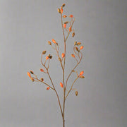 Narancssárga színű, mű csipkebogyó ág.