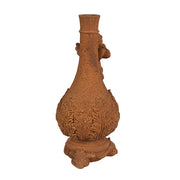 Rozsdabarna színű, antikolt felületű, angyal figurás gyertyatartó.