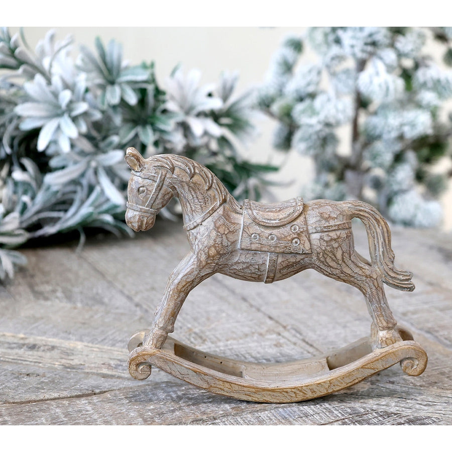 Natúr színű, fa hatású karácsonyi hintaló.