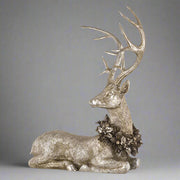 Pezsgőszínű karácsonyi szarvas figura.