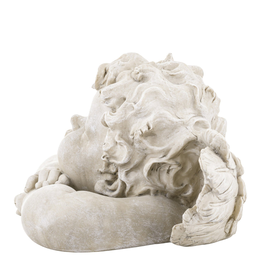 Kőhatású puttó figura.