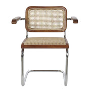 Modern fémvázas, barna színű, rattan betétes karosszék.