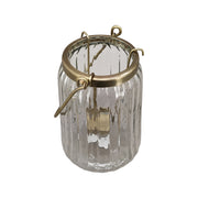 Bordázott üvegből és aranyszínű alumíniumból készült mécsestartó.