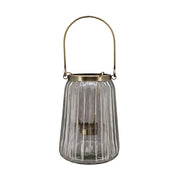 Bordázott üvegből és aranyszínű alumíniumból készült mécsestartó.