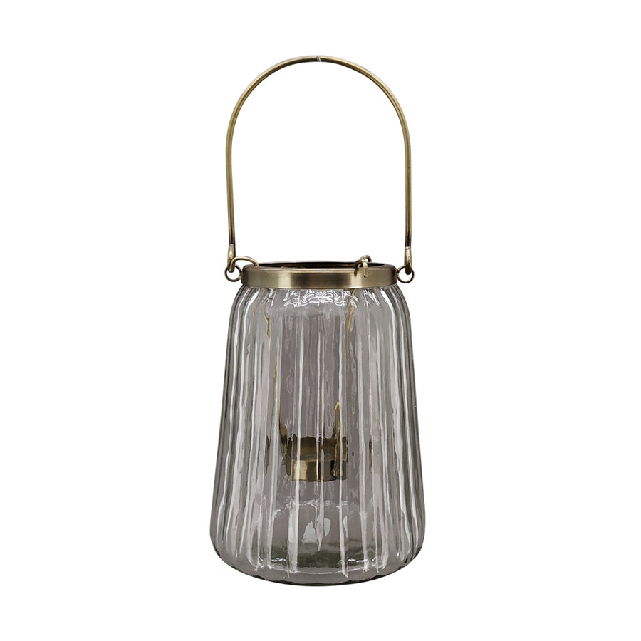 Bordázott üvegből és aranyszínű alumíniumból készült mécsestartó.