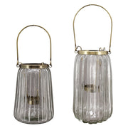 Bordázott üvegből és aranyszínű alumíniumból készült mécsestartó.