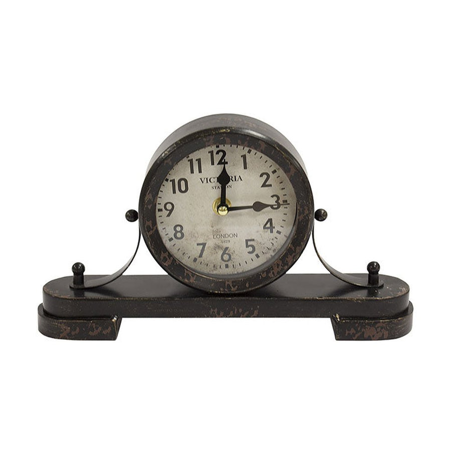 Antikolt felületű fém asztali óra.