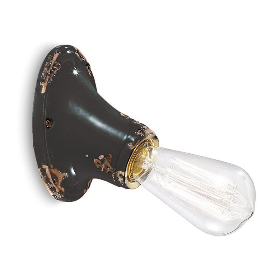 Antikolt felületű mázas kerámiából készült kézműves falilámpa.