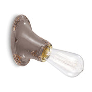 Antikolt felületű mázas kerámiából készült kézműves falilámpa.