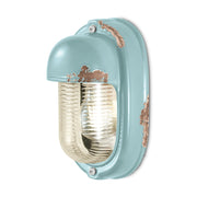 Antikolt felületű mázas kerámiából és bordázott üvegből készült kézműves falilámpa.